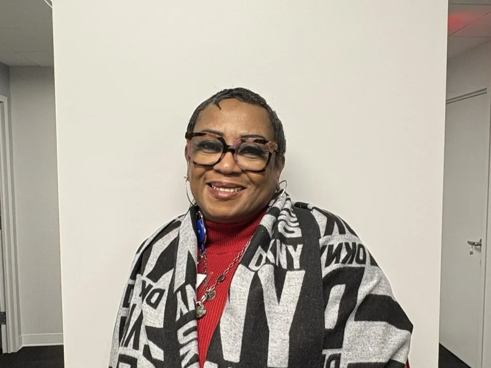 RBT Tina standing against a white wall