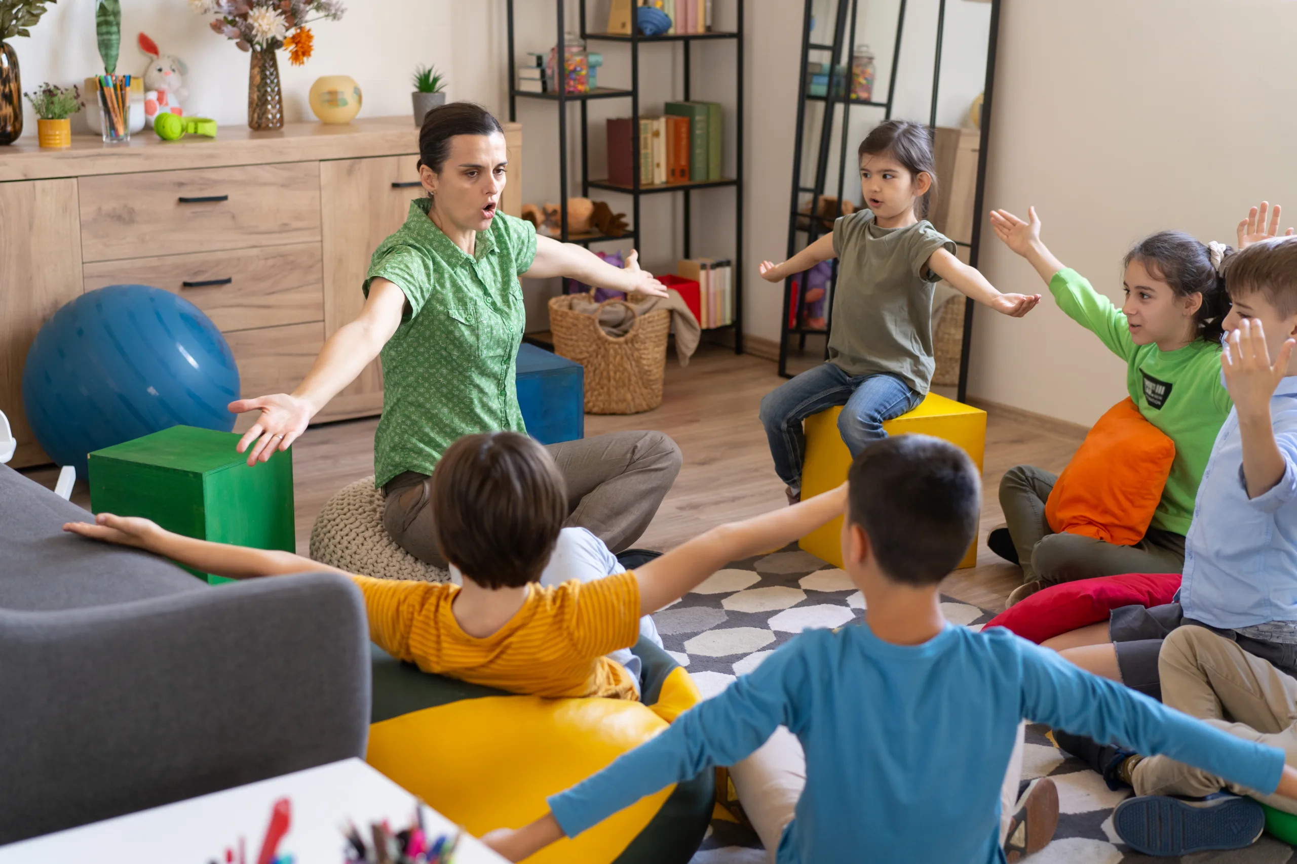 A sign language class with energetic children actively engaged with their teacher, crucial for fostering communication and development in speech therapy scenarios. Energetic kids and teacher in sign language class