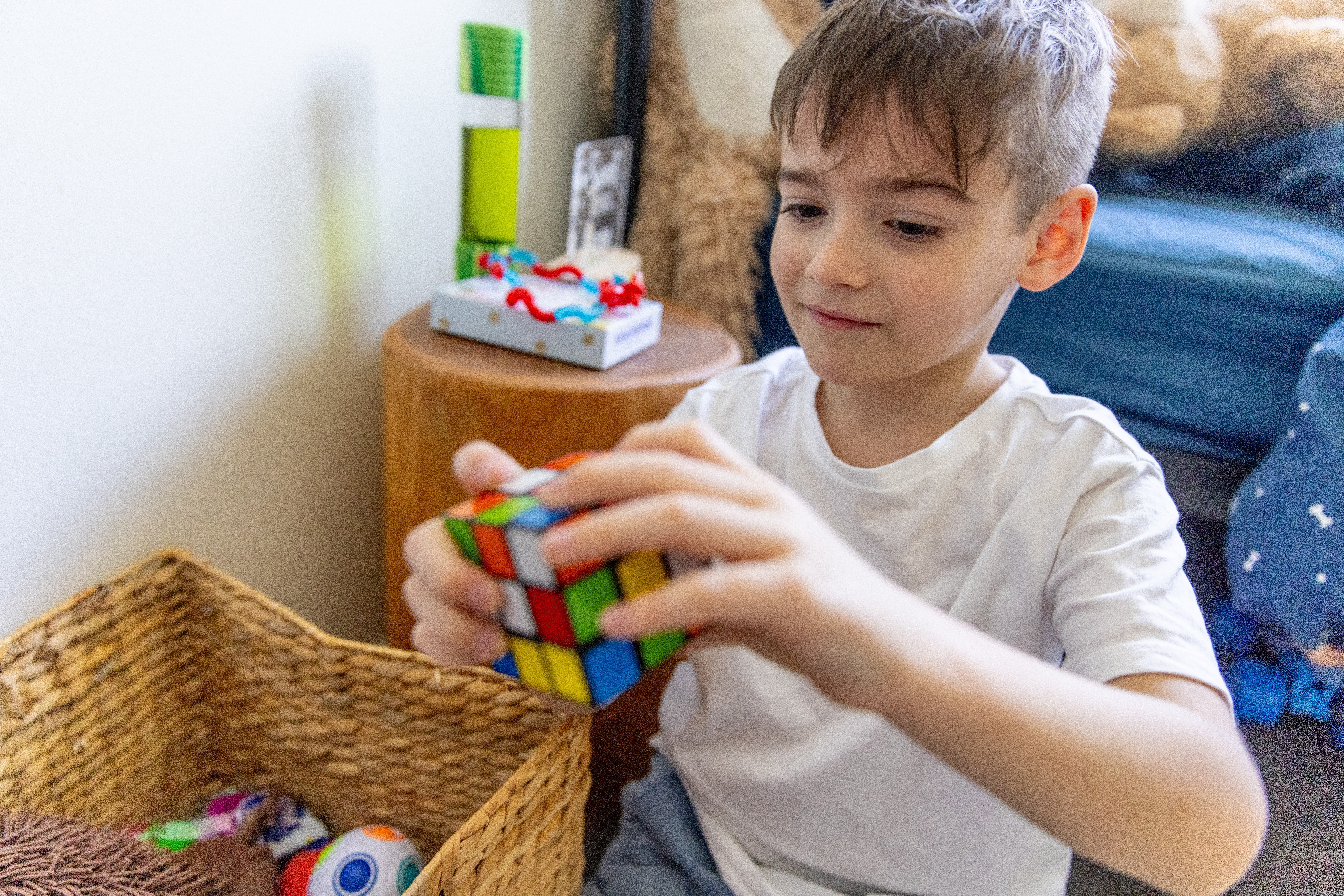 Boy enjoys playing in bedroom